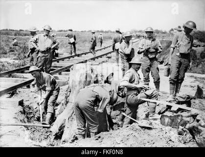 Ypres, WWI. British soldiers laying a light railway line near Boesinghe, Belgium, during the Battle of Passchendaele (the Third Battle of Ypres) in World War I, July 28, 1917. Stock Photo