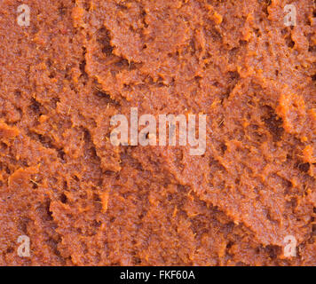 A very close view of red curry paste. Stock Photo
