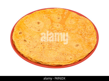 Several tomato tortilla wraps on a plate isolated on a white background. Stock Photo