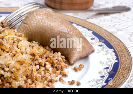 Skin of chicken neck or gooseneck, filled with chicken liver, onion, poultry fat and matzah meal, boiled in chicken bouillon and Stock Photo