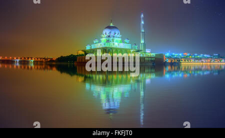 Sunset over Putrajaya Mosque and Panorama of Kuala Lumpur, Malaysia. Stock Photo