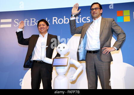 Tokyo, Japan. 8th Mar, 2016. Softbank Robotics president Fumihide Tomizawa (L) and Microsoft Japan president Takuya Hirano (R) mimic the pose of Softbank's humanoid robot Pepper as they announce a strategic collaboration in the field of cloud robotics in Tokyo on Tuesday, March 8, 2016. Pepper will offer customer service in store using Microsoft's Azur cloud platform. Credit:  Yoshio Tsunoda/AFLO/Alamy Live News Stock Photo