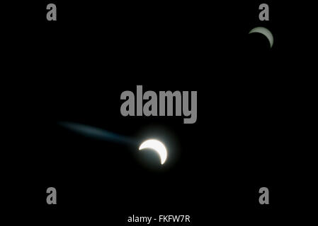 Banten province, Indonesia. 9th March, 2016. Solar eclipse with flares and a reflection in the corner seen from Banten province, Indonesia, on March 9th, 2016 at 7:35:14 AM. Stock Photo