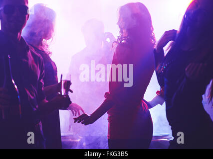 Group of people dancing in night club Stock Photo