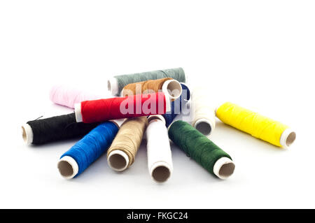 Colorful thread reel for dressmaker isolated on white background. Stock Photo