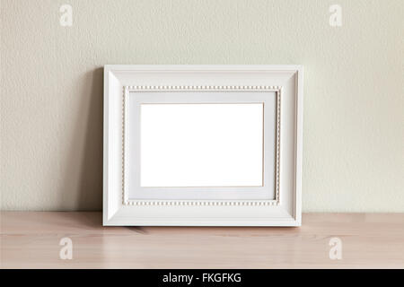 Image of an ornate white frame mockup scene. Stock Photo