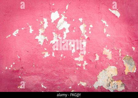 Peeling paint pink on the wall Stock Photo
