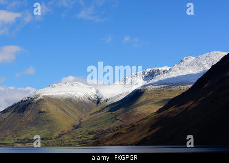 Wastwater with snow capped  Lingmell, Scafell pike and Scafell in the background Stock Photo
