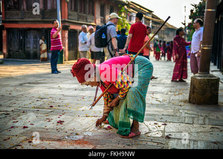 Very old woman with a walking stick in the street of Bandipur Stock Photo
