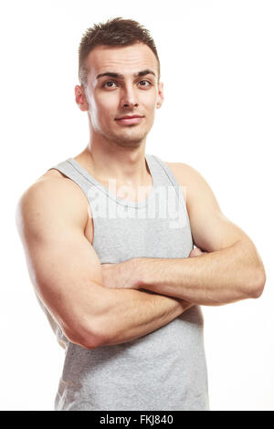 Handsome muscled sporty fit man. Portrait of young muscular guy isolated on white. Healthy lifestyle. Stock Photo