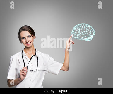 Female doctor in uniform touch painted brain Stock Photo