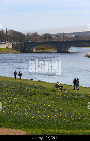 People walking beside the River Dee in the city of Aberdeen in Scotland, UK. Stock Photo
