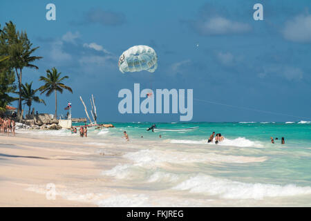 Parasailing  at the palm fringed sandy beach of Playa Bavaro, Punta Cana,  Dominican Republic, Carribean, America,