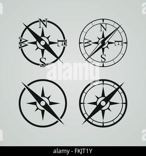 Vector icons depicting four different compasses Stock Vector