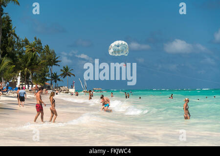 Parasailing  at the palm fringed sandy beach of Playa Bavaro, Punta Cana,  Dominican Republic, Carribean, America,