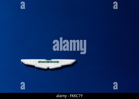 Aston Martin logo badge on metallic blue paint Stock Photo
