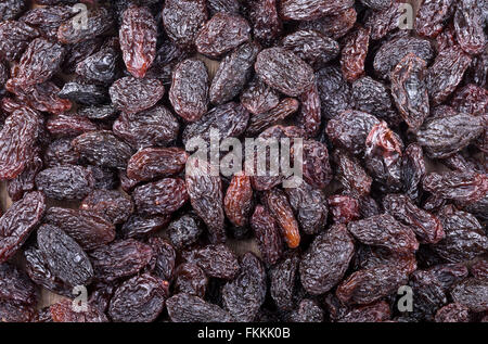 Heap of raisins frame filling background Stock Photo