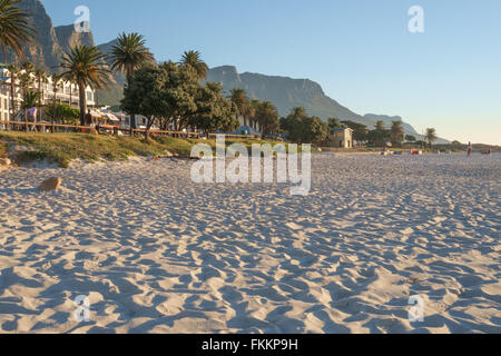 Sunset over Camps Bay beach, South Africa, with the twelve apostles mountains in the background Stock Photo