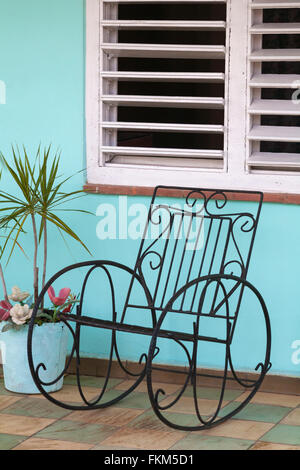 Wrought iron rocking chair on porch at Vinales, Pinar del Rio Province, Cuba, West Indies Stock Photo