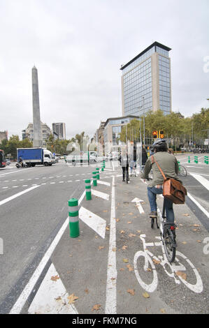 Urban cyclists. Juan Carlos I square, Diagonal avenue. Barcelona, Catalonia, Spain Stock Photo