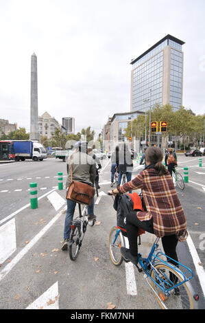 Urban cyclists. Juan Carlos I square, Diagonal avenue. Barcelona, Catalonia, Spain Stock Photo