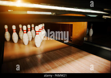 Ten white pins in a bowling alley lane Stock Photo