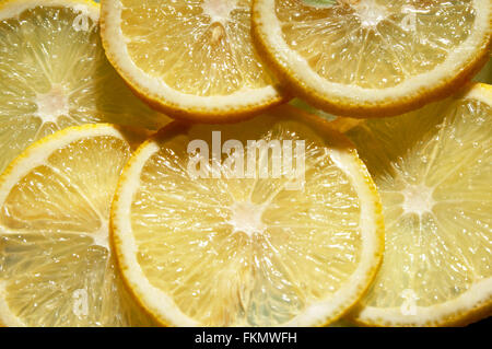 Segments of a ripe and fresh lemon Stock Photo