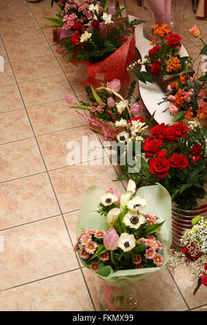 Different flowers on marble to a floor in flower shop Stock Photo