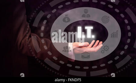 Businessman pressing an I.T. concept button. Stock Photo