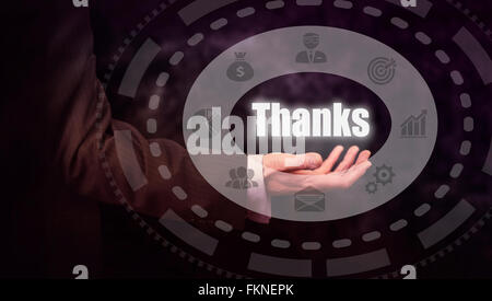 Businessman pressing a Thanks concept button. Stock Photo