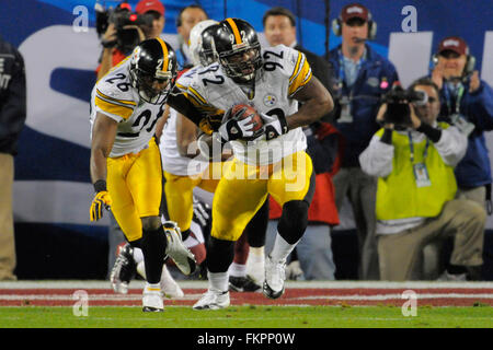 Pittsburgh Steelers linebacker James Harrison scores over Arizona Cardinals  wide receiver Larry Fitzgerald and Steve Breaston (15) on a Super Bowl  record 100-yard interception returned for a touchdown during the second  quarterat