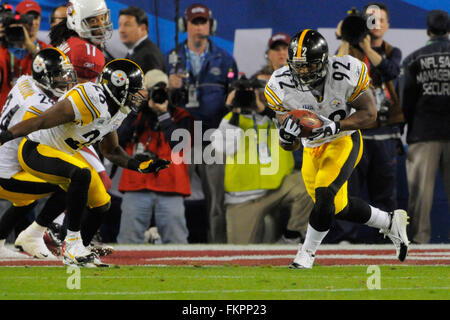 Pittsburgh Steelers linebacker James Harrison scores over Arizona Cardinals  wide receiver Larry Fitzgerald and Steve Breaston (15) on a Super Bowl  record 100-yard interception returned for a touchdown during the second  quarterat