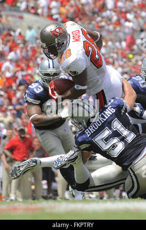 Tampa, Florida, UNITED STATES. 13th Sep, 2009. Sept 13, 2009; Tampa, FL, USA; Tampa Bay Buccaneers running back Derrick Ward (28) is tackled by Dallas Cowboys linebacker Keith Brooking (51) during their game at Raymond James Stadium. ZUMA Press/Scott A. Miller © Scott A. Miller/ZUMA Wire/Alamy Live News Stock Photo