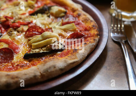 Wood pizza on wooden plate Stock Photo