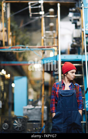 Young woman working in the factory Stock Photo