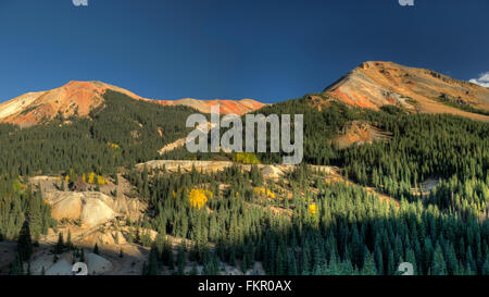 Two of the peaks of Red Mountain (#2 and #3) and old mining ruins near Red Mountain Pass between Ouray and Silverton, Colorado a Stock Photo
