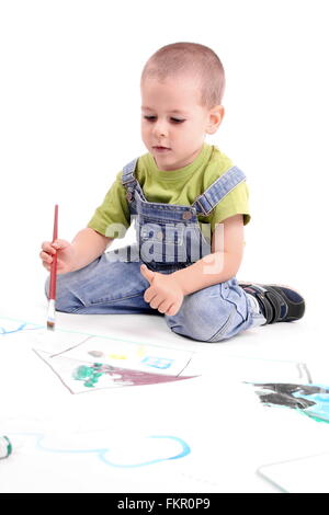 young boy painting over white Stock Photo
