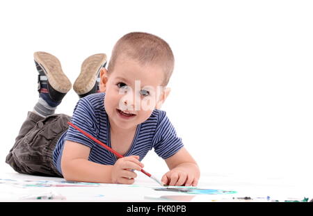 Little boy painting over white Stock Photo