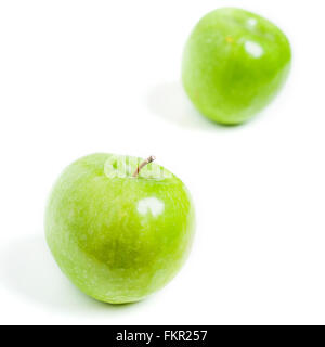 two granny smith apples isolated on white Stock Photo