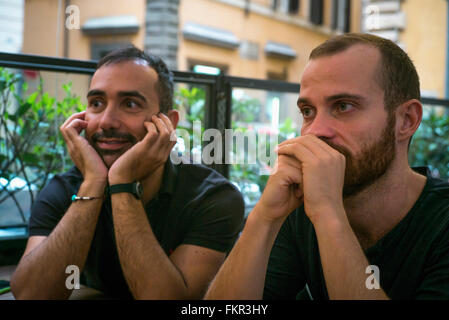 Caucasian men sitting in cafe Stock Photo