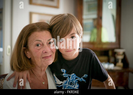 Caucasian grandmother and grandson hugging Stock Photo