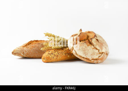 freshly baked bread and baguettes on white background Stock Photo