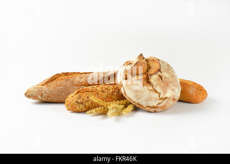 freshly baked bread and baguettes on white background Stock Photo