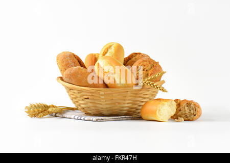 basket of various bread rolls and buns on white background Stock Photo
