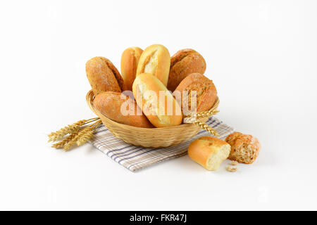 basket of various bread rolls and buns on white background Stock Photo