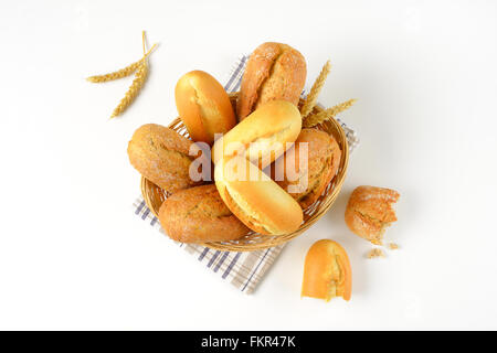 basket of various bread rolls and buns on white background Stock Photo