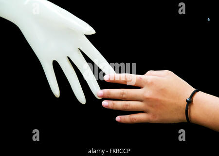 Relation concept : Human hand with plastic hand Stock Photo