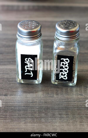 Salt and pepper shakers on light grey table, closeup. Space for text Stock  Photo - Alamy