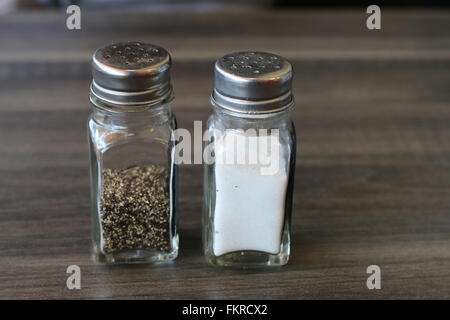 Salt and pepper shakers on light grey table, closeup. Space for text Stock  Photo - Alamy