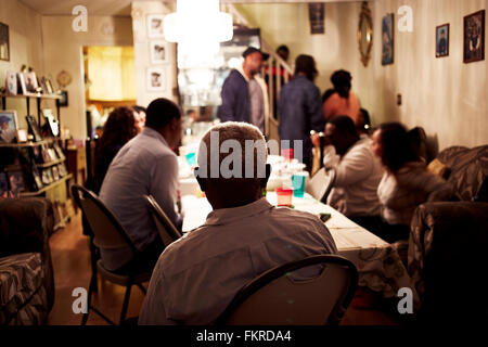 Family eating dinner at table Stock Photo